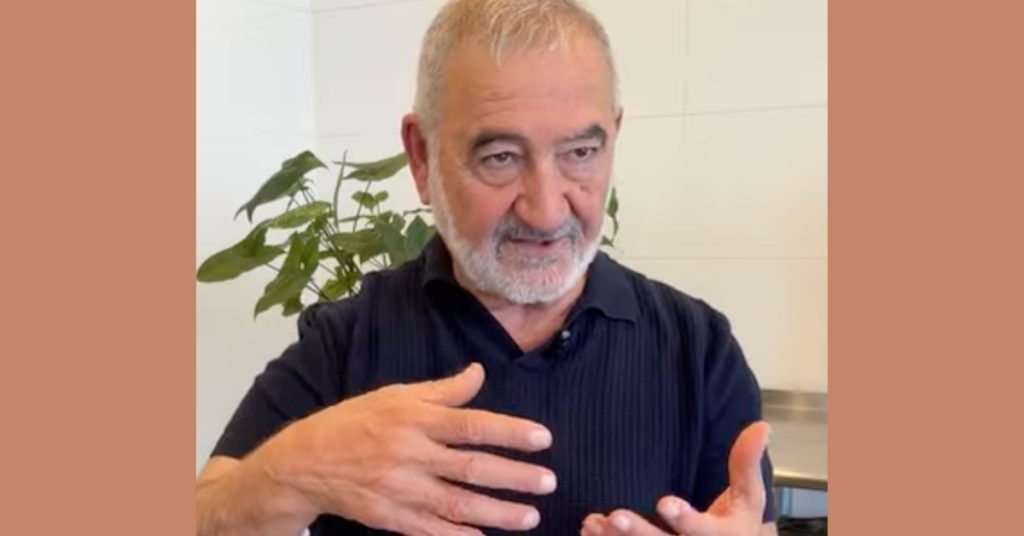 Joseph Atallah from Zou Zou Coffee wears a black collared shirt and speaks to camera.